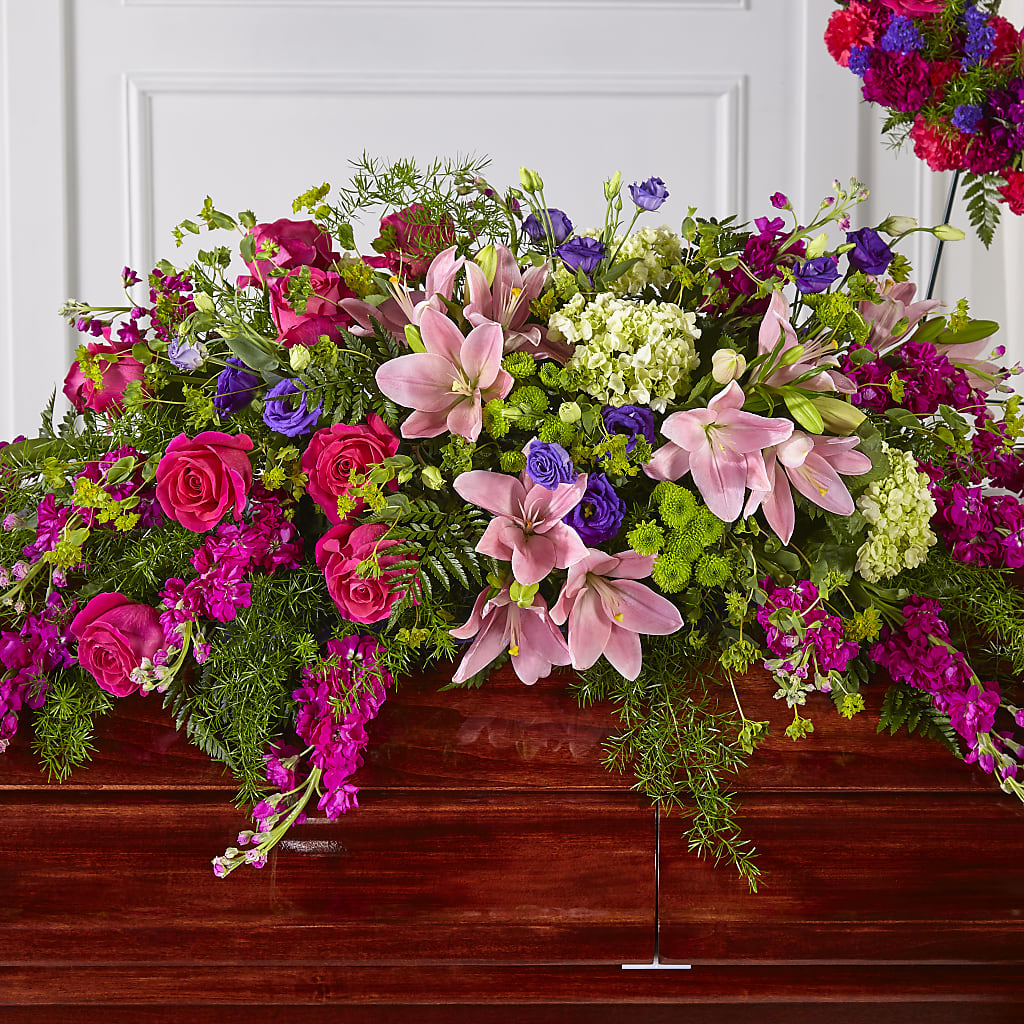 Radiant Tribute Casket Spray – TREASURE HUT FLOWERS GIFTS & GHSES, Delavan WI