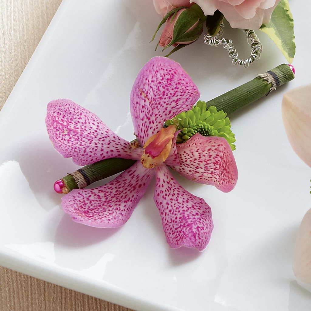Pink Mokara Boutonniere – TREASURE HUT FLOWERS GIFTS & GHSES, Delavan WI